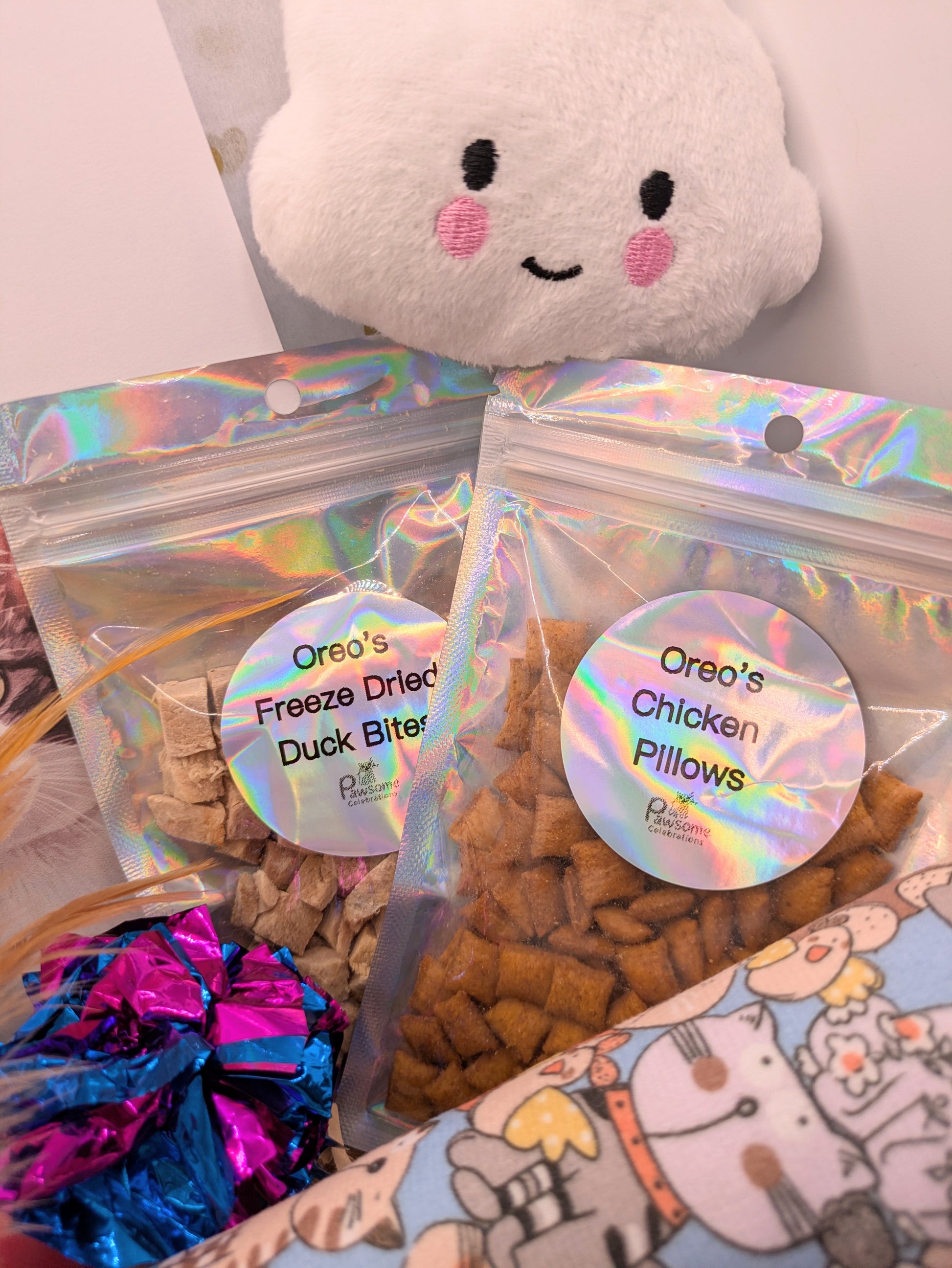 cat kicker toy, crinkle ball, plush toy and cat treats.