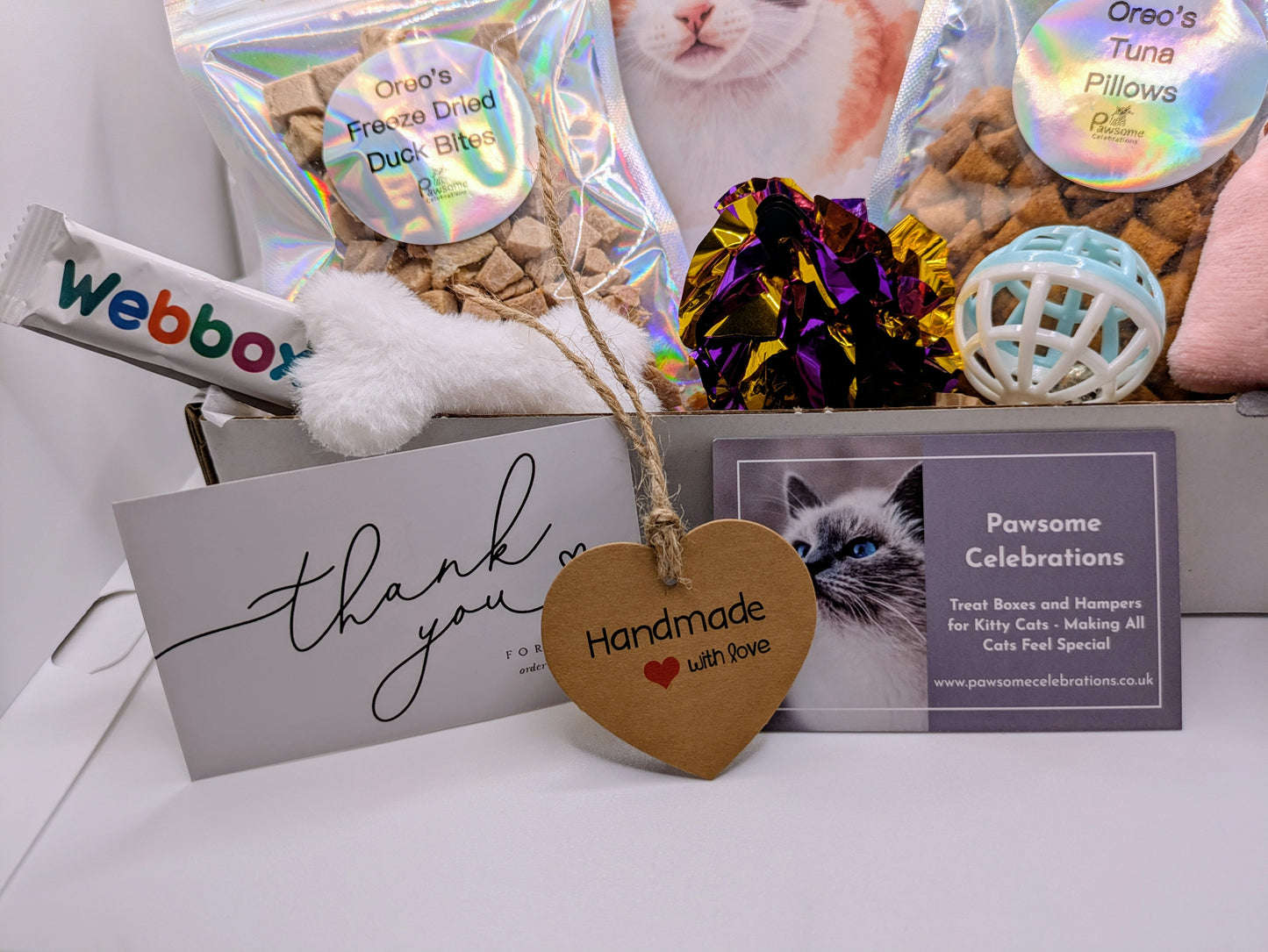 Handmade label and Pawsome Celebration card with cat toys and treats