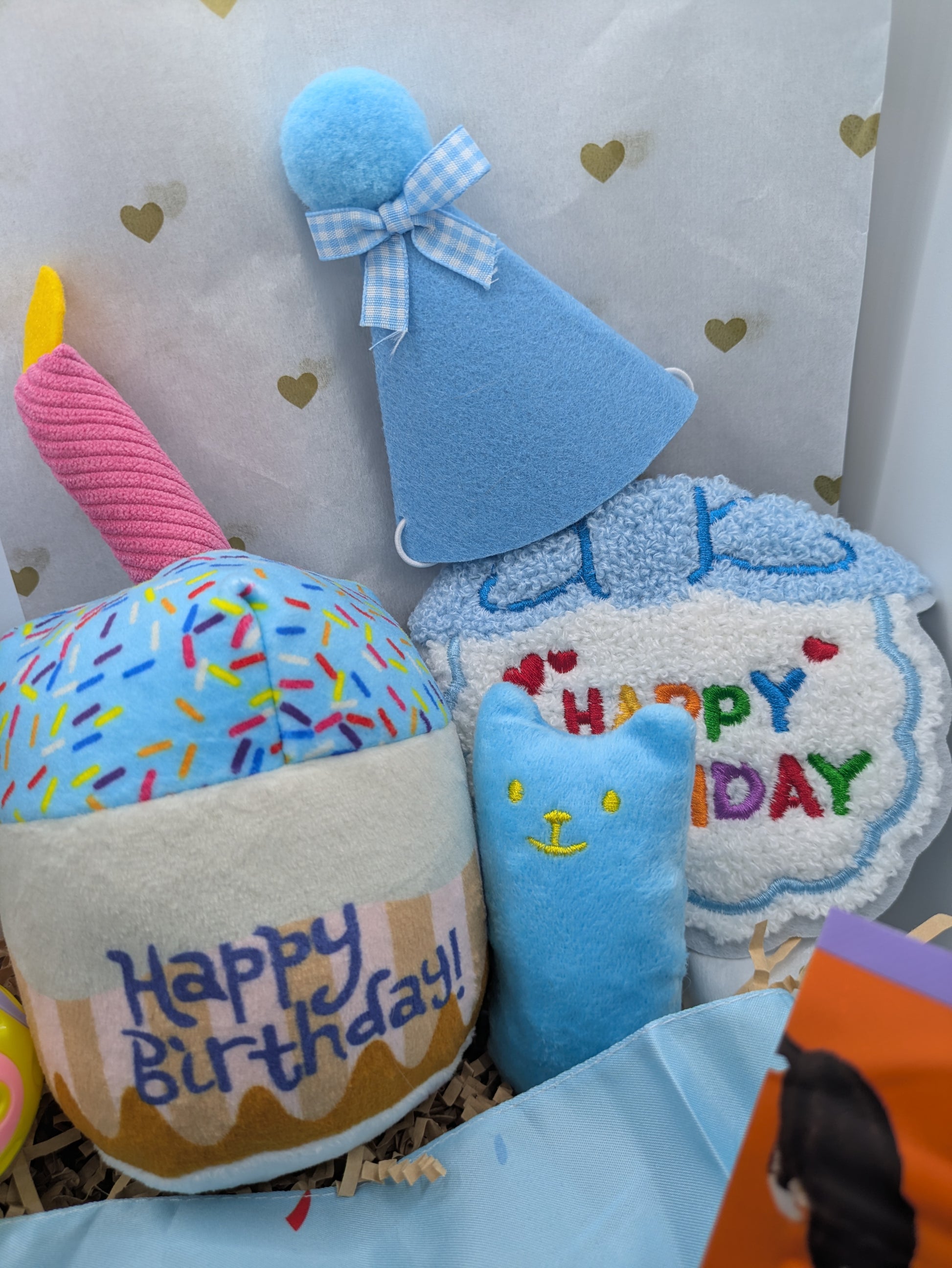 Birthday hat, cake and toys for cats in blue theme